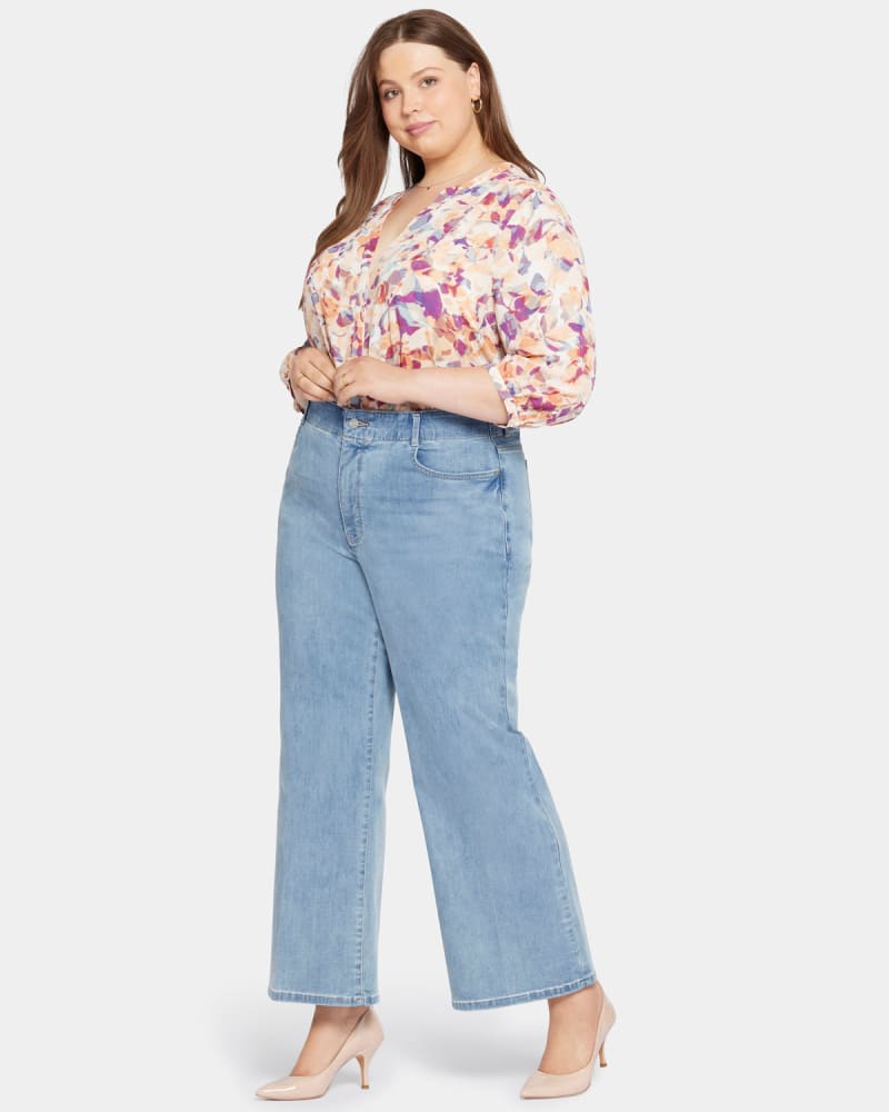 Front of a model wearing a size 0X Marge Wide Leg Jeans in Crystalline by NYDJ. | dia_product_style_image_id:296176